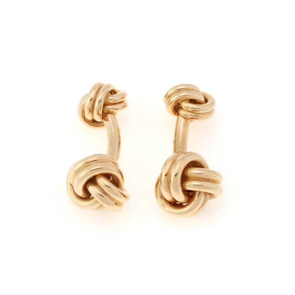 Pair of 14k Yellow Gold Love Knot Cufflinks: Pair of 14k Yellow Gold Love Knot Cufflinks Crafted from luxurious 14k yellow gold, this exquisite pair of love knot cufflinks showcases an elegant design with a double end grooved strip fashioned int