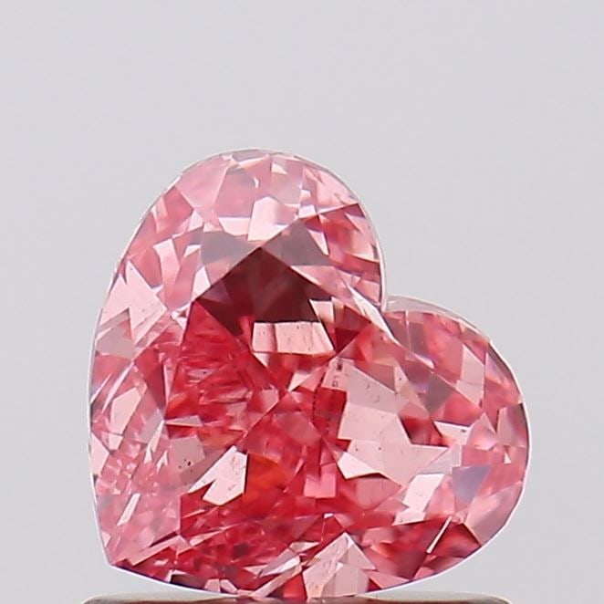 Loose Diamond - HEART 1.06ct Fancy Vivid Pink VS2: Loose Diamond - HEART 1.06ct Fancy Vivid Pink VS2 Source: This is a real non-mined Diamond that has been grown in a lab Shape: HEART Carats: 1.06 Color: Fancy Vivid Pink Certification: IGI Video:
