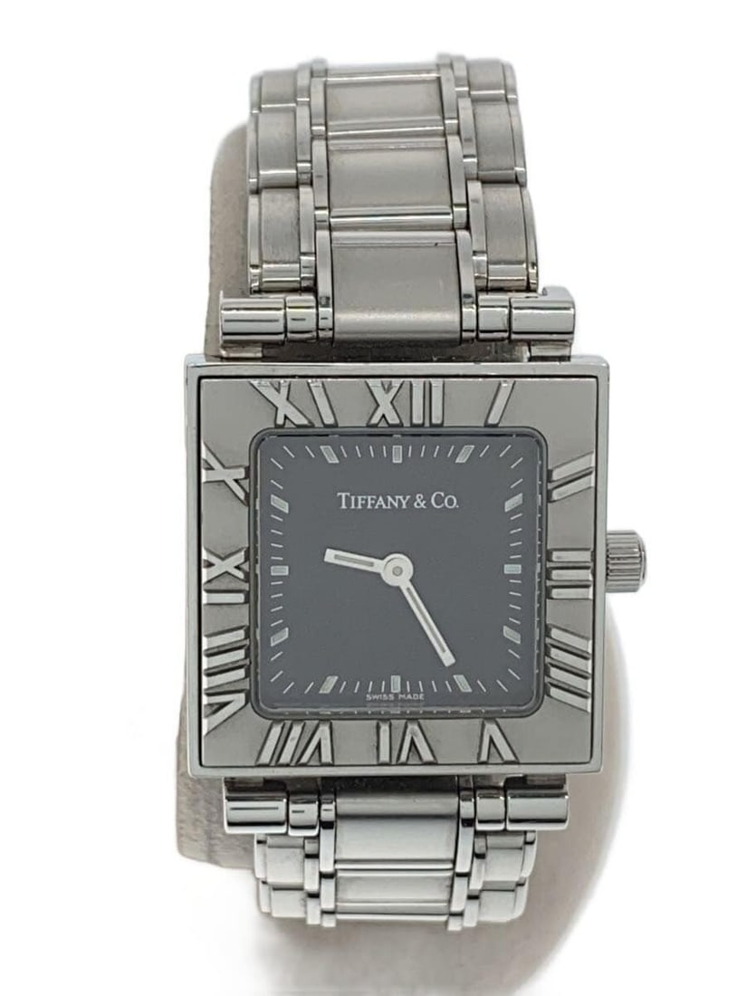 Women's Tiffany Co Atlas Square Quartz Black Dial Wristwatch: Women's Tiffany Co Atlas Square Quartz Black Dial Wristwatch This is a pre-owned Tiffany & Co. Atlas Square quartz wristwatch designed for women. It features a black dial and is crafted in Switzerland