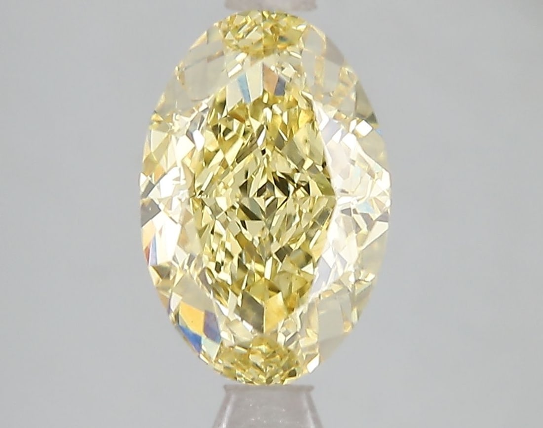 Loose Diamond - OVAL 3.04ct Fancy Vivid Yellow VS1: Loose Diamond - OVAL 3.04ct Fancy Vivid Yellow VS1 Source: This is a real non-mined Diamond that has been grown in a lab Shape: OVAL Carats: 3.04 Color: Fancy Vivid Yellow Certification: IGI Video: