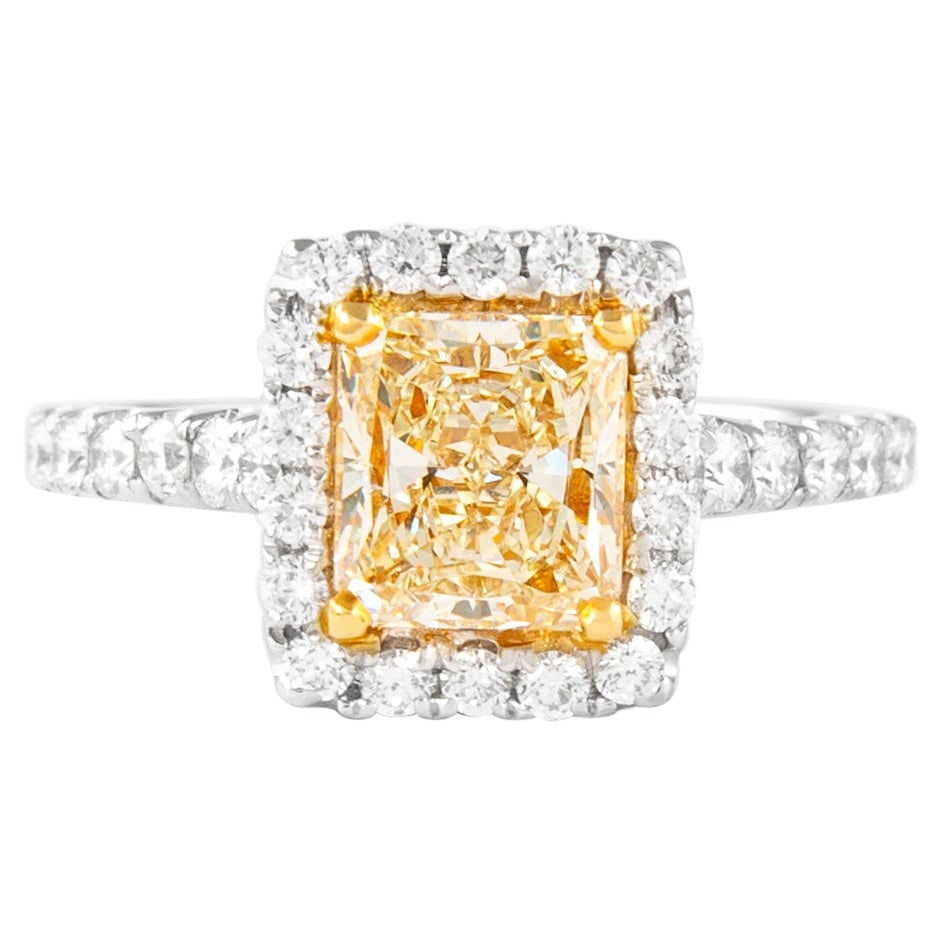 2.21ct Fancy Yellow VS1 Diamond Halo Ring 18k Gold: 2.21ct Fancy Yellow VS1 Diamond Halo Ring 18k Gold This exquisite 2.21ctt Fancy Yellow VS1 Cushion Diamond Halo Ring showcases a stunning modern design crafted in two-tone 18k gold, featuring both yel