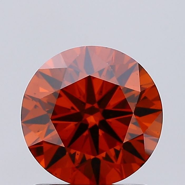 Loose Diamond - ROUND 1.3ct Fancy Vivid Orange VS2: Loose Diamond - ROUND 1.3ct Fancy Vivid Orange VS2 Source: This is a real non-mined Diamond that has been grown in a lab Shape: ROUND Carats: 1.3 Color: Fancy Vivid Orange Certification: IGI Video: