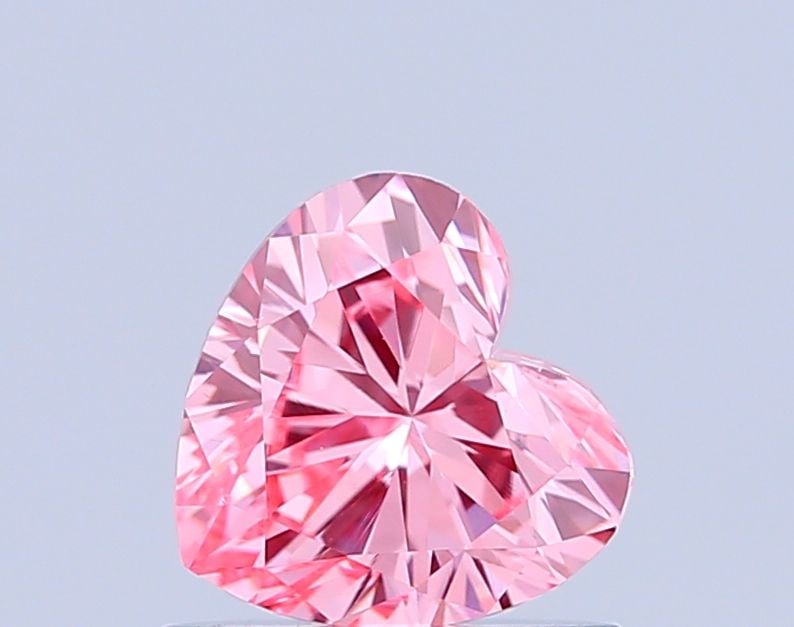 Loose Diamond - HEART 0.7ct Fancy Vivid Pink VS1: Loose Diamond - HEART 0.7ct Fancy Vivid Pink VS1 Source: This is a real non-mined Diamond that has been grown in a lab Shape: HEART Carats: 0.7 Color: Fancy Vivid Pink Certification: IGI Video: