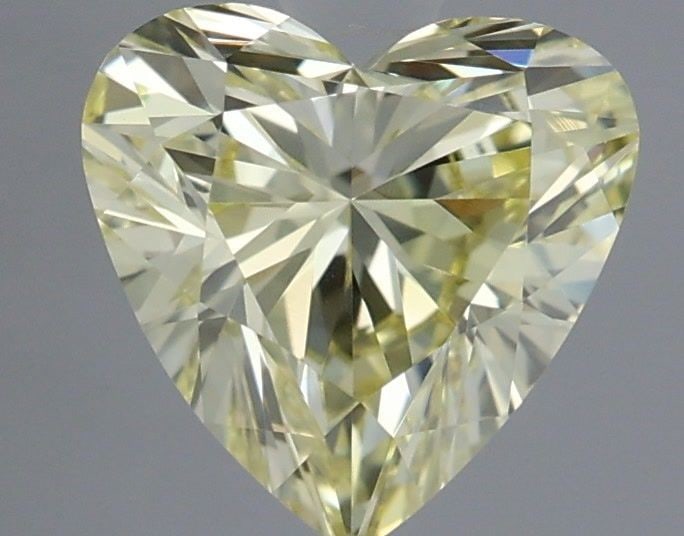 Loose Diamond - HEART 0.76ct Fancy Yellow VVS2: Loose Diamond - HEART 0.76ct Fancy Yellow VVS2 Source: This is a real non-mined Diamond that has been grown in a lab Shape: HEART Carats: 0.76 Color: Fancy Yellow Certification: IGI The Diamond Depot 