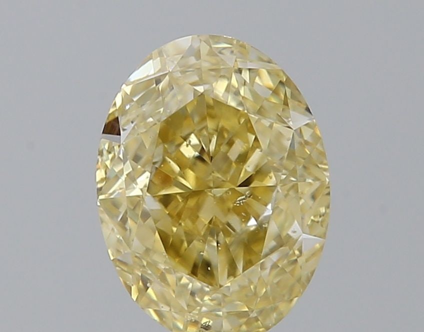 Loose Diamond - OVAL 1.24ct Fancy Yellow SI2: Loose Diamond - OVAL 1.24ct Fancy Yellow SI2 Source: Natural Shape: OVAL Carats: 1.24 Color: Fancy Yellow Certification: GIA Video: