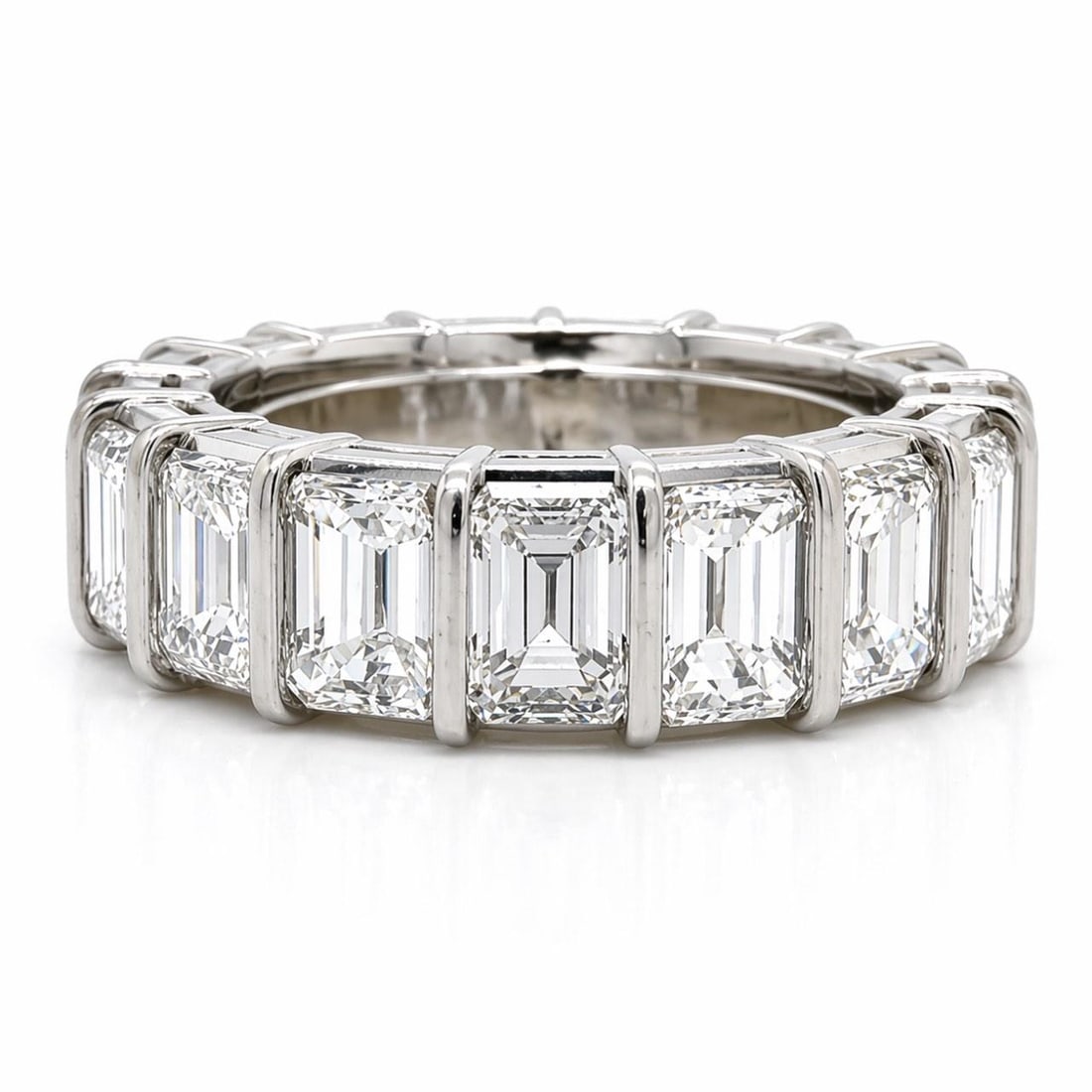 Emerald Cut Diamond Eternity Ring in Platinum 7.65 Carats Size 5: Emerald Cut Diamond Eternity Ring in Platinum 7.65 Carats Size 5 This platinum eternity band features 17 emerald-cut diamonds with a total weight of approximately 7.65 carats. The diamonds are graded 