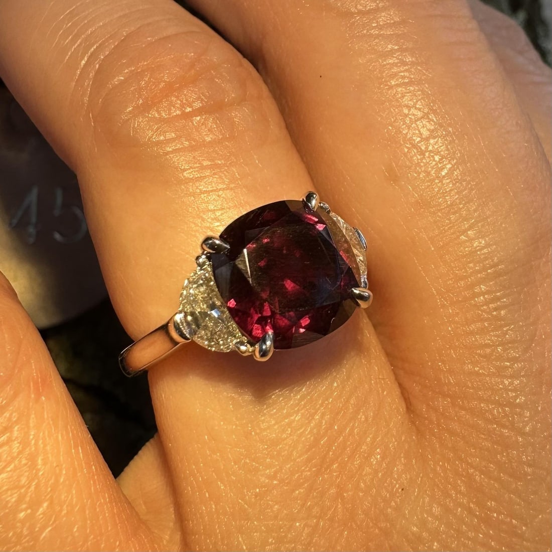 Platinum Cocktail Ring GIA 5.94ctw Color Change Garnet with Half Moon Diamonds: Platinum Cocktail Ring GIA 5.94ctw Color Change Garnet with Half Moon Diamonds Vintage garnet in a custom-made cocktail ring featuring a natural cushion-cut color change garnet accented by two half mo