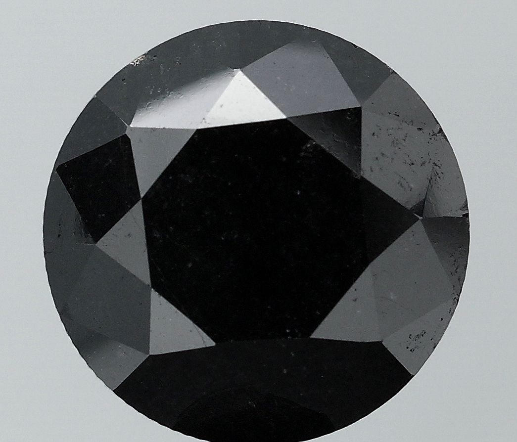 Loose Diamond - ROUND 11.91ct Fancy Black SI1: Loose Diamond - ROUND 11.91ct Fancy Black SI1 Source: Natural Shape: ROUND Carats: 11.91 Color: Fancy Black Certification: NONE Video: