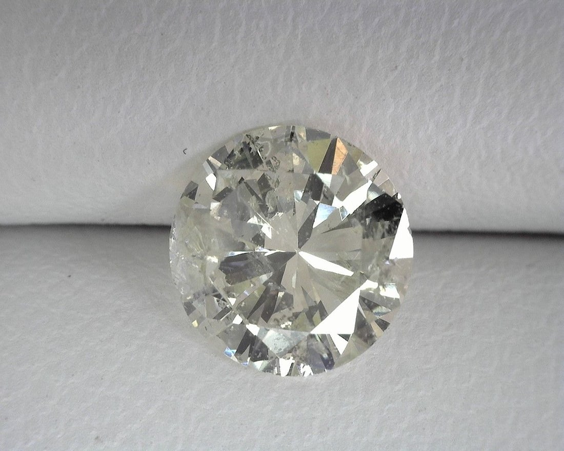 Loose Diamond - ROUND 0.94ct L I1: Loose Diamond - ROUND 0.94ct L I1 Source: Natural Shape: ROUND Carats: 0.94 Color: L Clarity: I1 Certification: OTHER The Diamond Depot Guarantee: All items in this auction are guaranteed to be 100% a