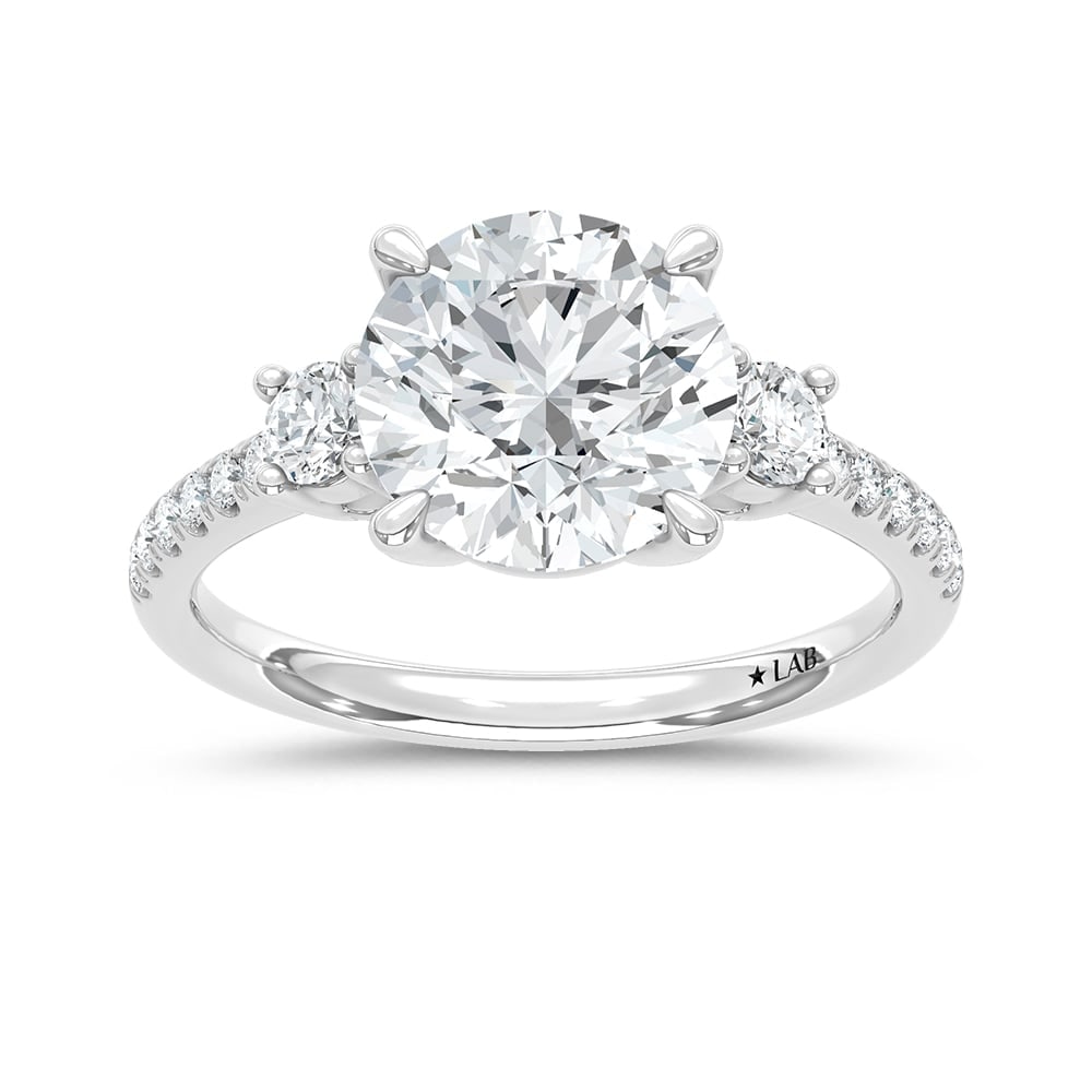 14K White Gold Lab Grown Diamond 2 3/8 Ct.Tw. Round Shape Engagement Ring (IGI Certified Center 3ct): 14K White Gold Lab Grown Diamond 2 3/8 Ct.Tw. Round Shape Engagement Ring (IGI Certified Center 3ct) Shine brilliantly with this exquisite 14K white gold engagement ring, featuring a stunning 3-carat 