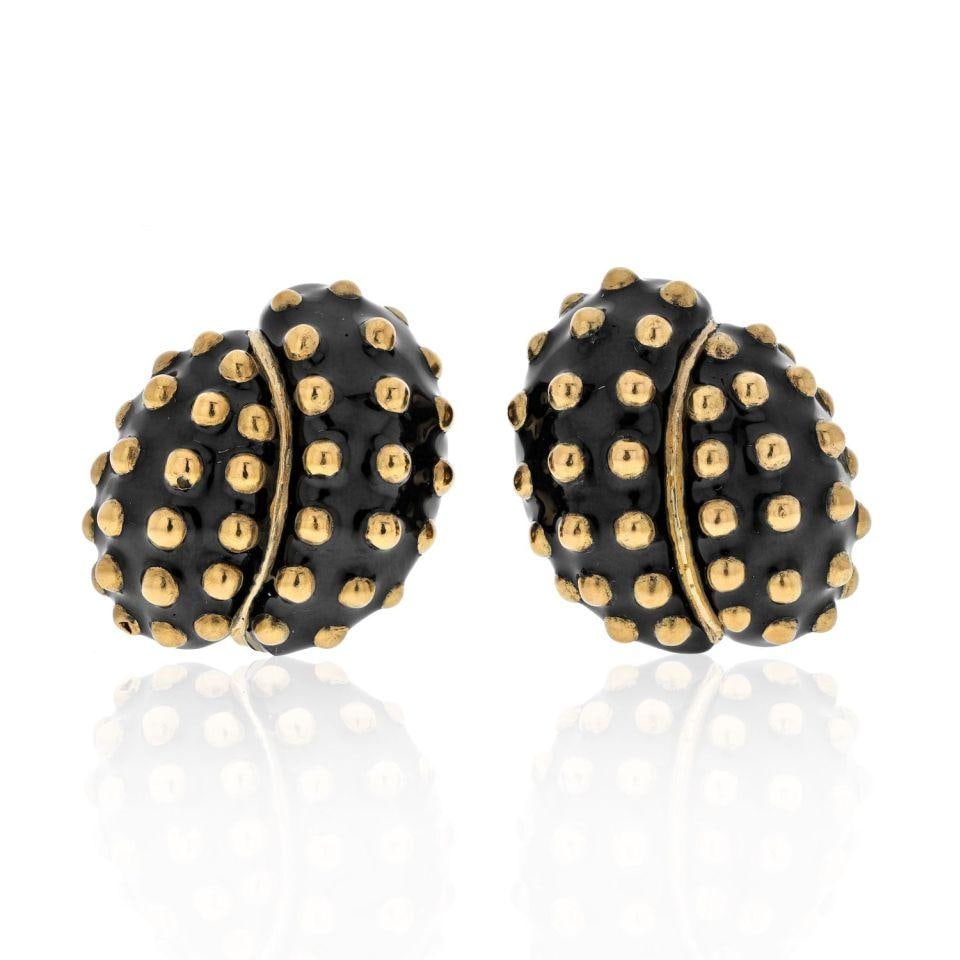 David Webb Platinum 18K Yellow Gold Black Enamel Clip Earrings: David Webb Platinum 18K Yellow Gold Black Enamel Clip Earrings Discover these exquisite David Webb clip earrings, a stunning blend of platinum and 18K yellow gold. These unique earrings showcase a cap