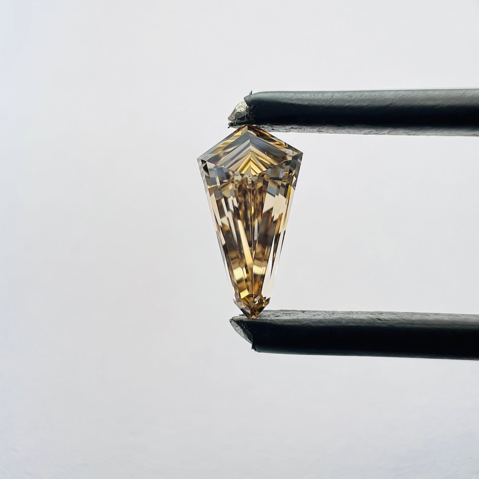 Loose Diamond - KITE 0.51ct Brown VVS2: Loose Diamond - KITE 0.51ct Brown VVS2 Source: This is a real non-mined Diamond that has been grown in a lab Shape: KITE Carats: 0.51 Color: Brown Certification: NONE The Diamond Depot Guarantee: All 