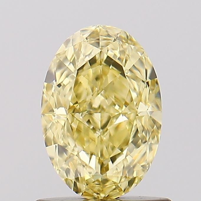 Loose Diamond - OVAL 1.11ct Fancy Vivid Yellow VS1: Loose Diamond - OVAL 1.11ct Fancy Vivid Yellow VS1 Source: This is a real non-mined Diamond that has been grown in a lab Shape: OVAL Carats: 1.11 Color: Fancy Vivid Yellow Certification: IGI Video: