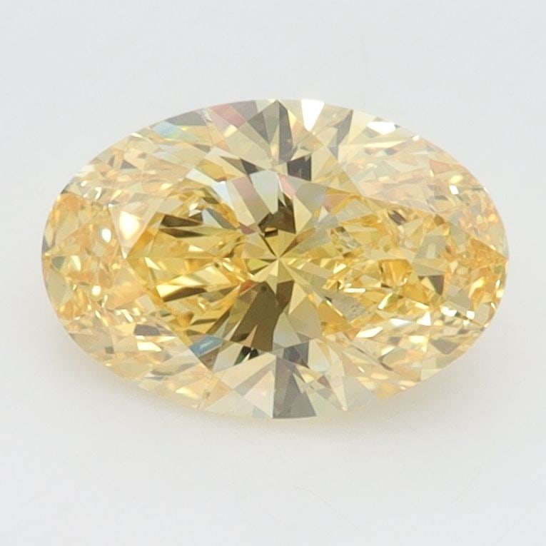 Loose Diamond - OVAL 1.3ct Fancy Vivid Yellow VS1: Loose Diamond - OVAL 1.3ct Fancy Vivid Yellow VS1 Source: This is a real non-mined Diamond that has been grown in a lab Shape: OVAL Carats: 1.3 Color: Fancy Vivid Yellow Certification: IGI Video: