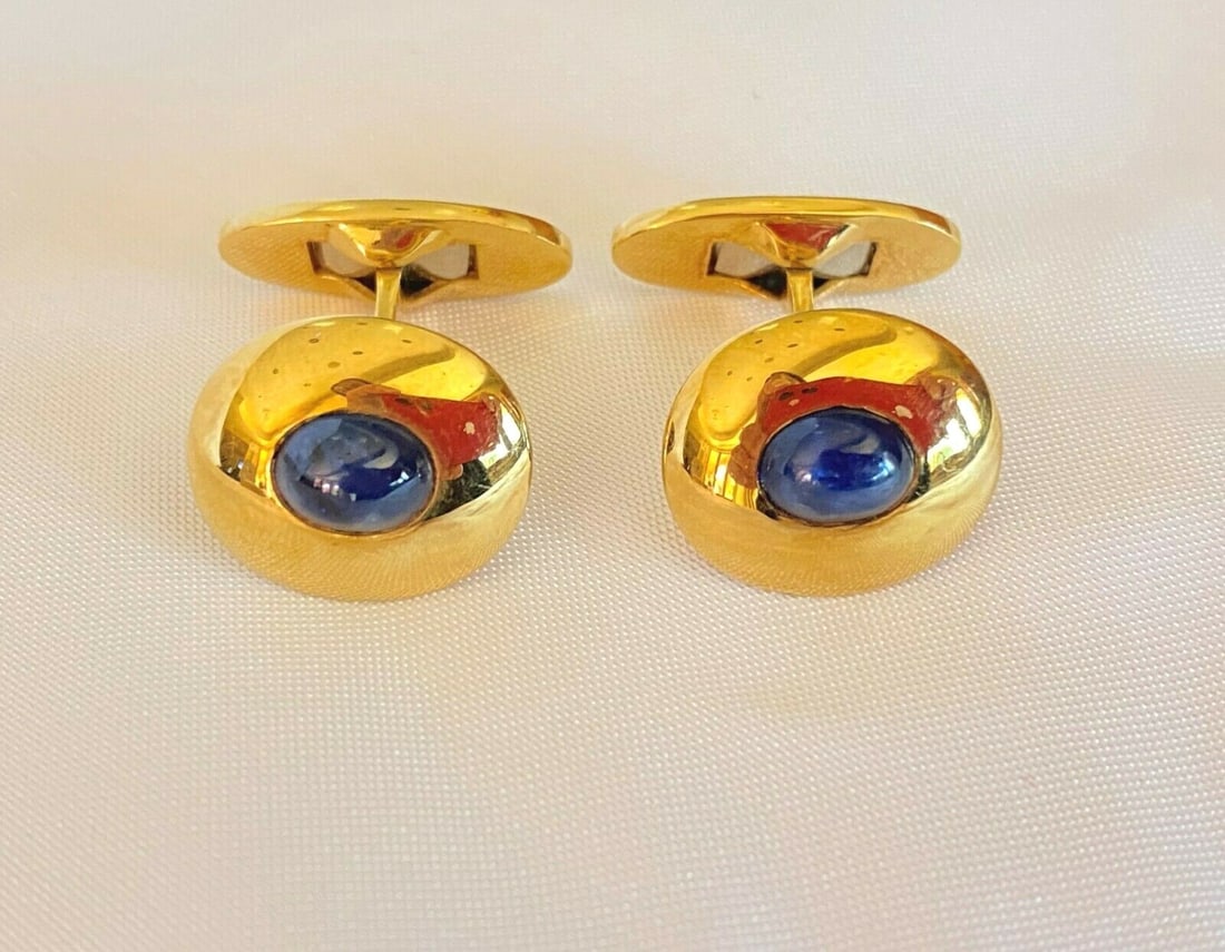 French 18K Yellow Gold Sapphire Cufflinks Pair Hallmarked: French 18K Yellow Gold Sapphire Cufflinks Pair Hallmarked Elevate your formal attire with this exquisite pair of cufflinks crafted from 18K yellow gold and adorned with stunning sapphires. Each sapphi
