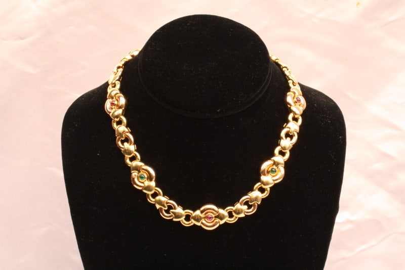 EBEL 18K Gold Locket Necklace with Ruby Sapphire Emerald and Leather Bag: EBEL 18K Gold Locket Necklace with Ruby Sapphire Emerald and Leather Bag Discover the elegance of this stunning necklace crafted by EBEL, featuring exquisite 18K yellow gold adorned with vibrant ruby,