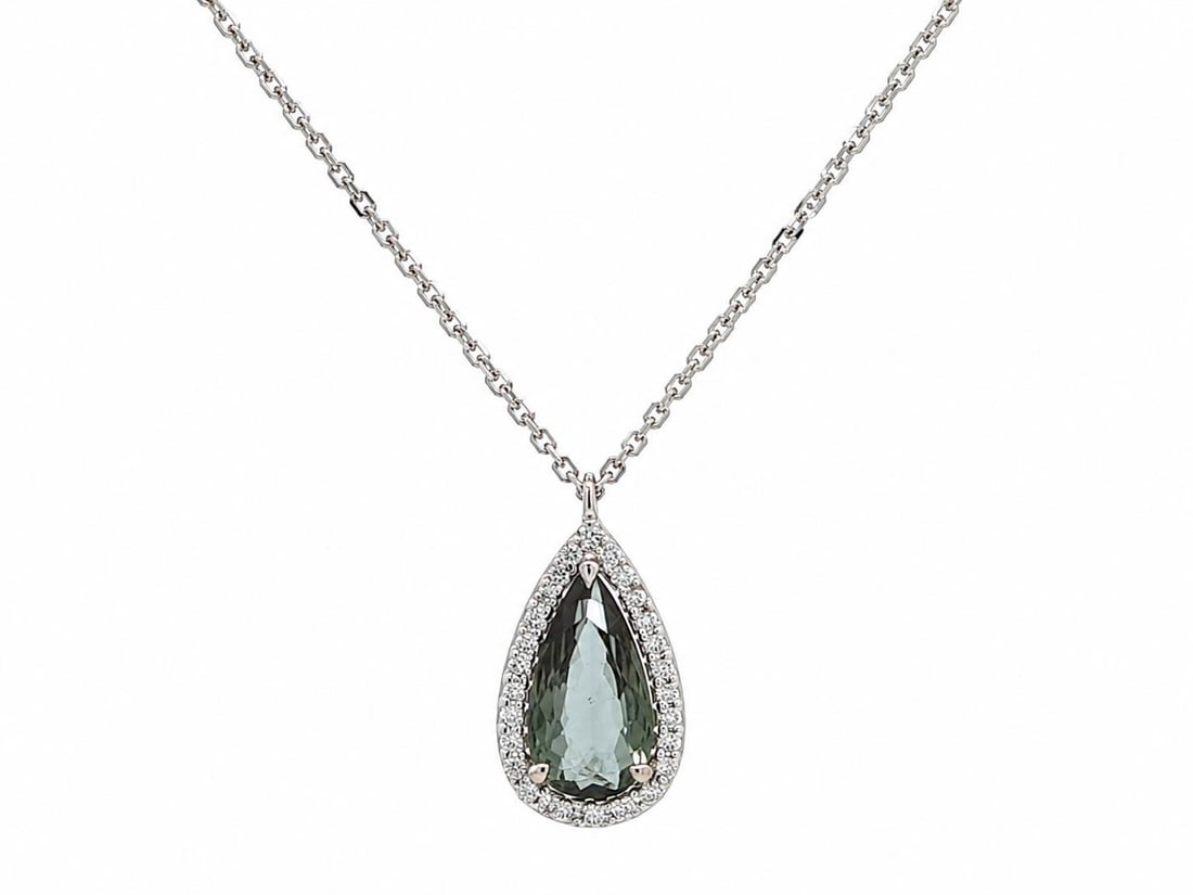 GIA Certified 18k White Gold Alexandrite Diamond Halo Pendant: GIA Certified 18k White Gold Alexandrite Diamond Halo Pendant This un-used pendant features a natural pear-shaped alexandrite, GIA-certified, with a unique color change from bluish green to grayish pu
