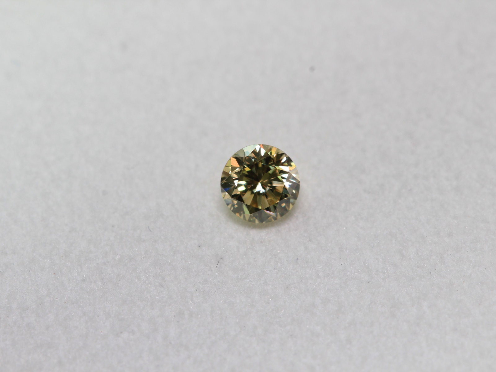 Loose Diamond - ROUND 0.14ct Fancy Light Yellow SI1: Loose Diamond - ROUND 0.14ct Fancy Light Yellow SI1 Source: Natural Shape: ROUND Carats: 0.14 Color: Fancy Light Yellow Certification: IGI Video: