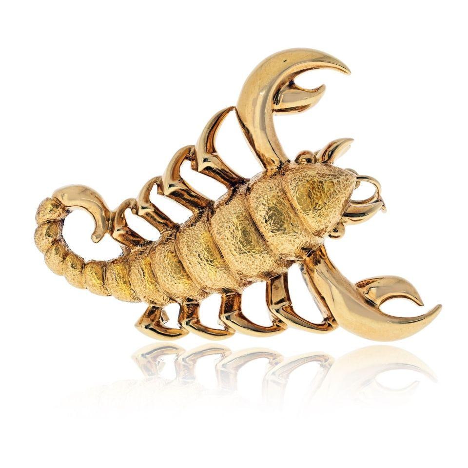 Scorpio Zodiac Versatile Brooch Pendant in 18K Yellow Gold by A. Clunn: Scorpio Zodiac Versatile Brooch Pendant in 18K Yellow Gold by A. Clunn This A. Clunn Scorpio brooch pendant is expertly crafted in 18K yellow gold and features a bold zodiac motif representing Scorpio