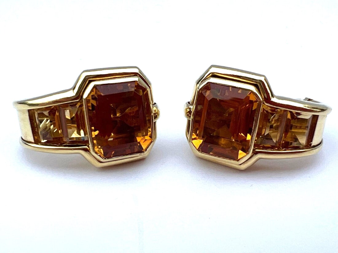 Pair of Italian 18K Yellow Gold Citrine Earrings Signed and Hallmarked: Pair of Italian 18K Yellow Gold Citrine Earrings Signed and Hallmarked This pair of Italian earrings is crafted from 18K yellow gold and features emerald-cut, trapezoid-shaped citrine stones. The earr
