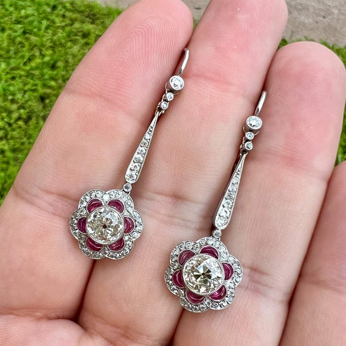 Elegant Platinum Ruby Diamond Earrings 1.75 inches 12 Rubies 80 Diamonds: Elegant Platinum Ruby Diamond Earrings 1.75 inches 12 Rubies 80 Diamonds These exquisite Platinum Ruby & Diamond Earrings feature a stunning design that showcases 12 rubies with a total weight of appr