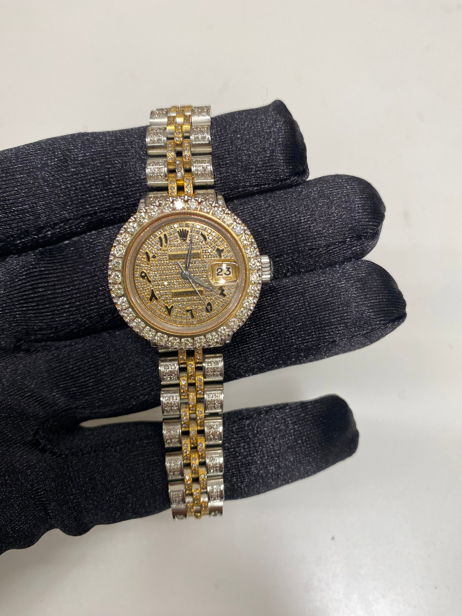Ladies Iced Out Rolex Datejust 6524 Arabic Dial Jubilee Bracelet Aftermarket: Ladies Iced Out Rolex Datejust 6524 Arabic Dial Jubilee Bracelet Aftermarket This ladies Rolex Datejust features an iced out Arabic dial, prong plated bezel, and a Jubilee bracelet that is also iced o