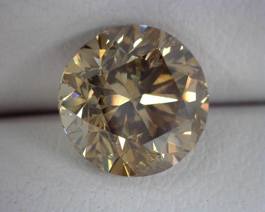 Loose Diamond - ROUND 1.5ct Brown I1: Loose Diamond - ROUND 1.5ct Brown I1 Source: Natural Shape: ROUND Carats: 1.5 Color: Brown Certification: OTHER The Diamond Depot Guarantee: All items in this auction are guaranteed to be 100% authent