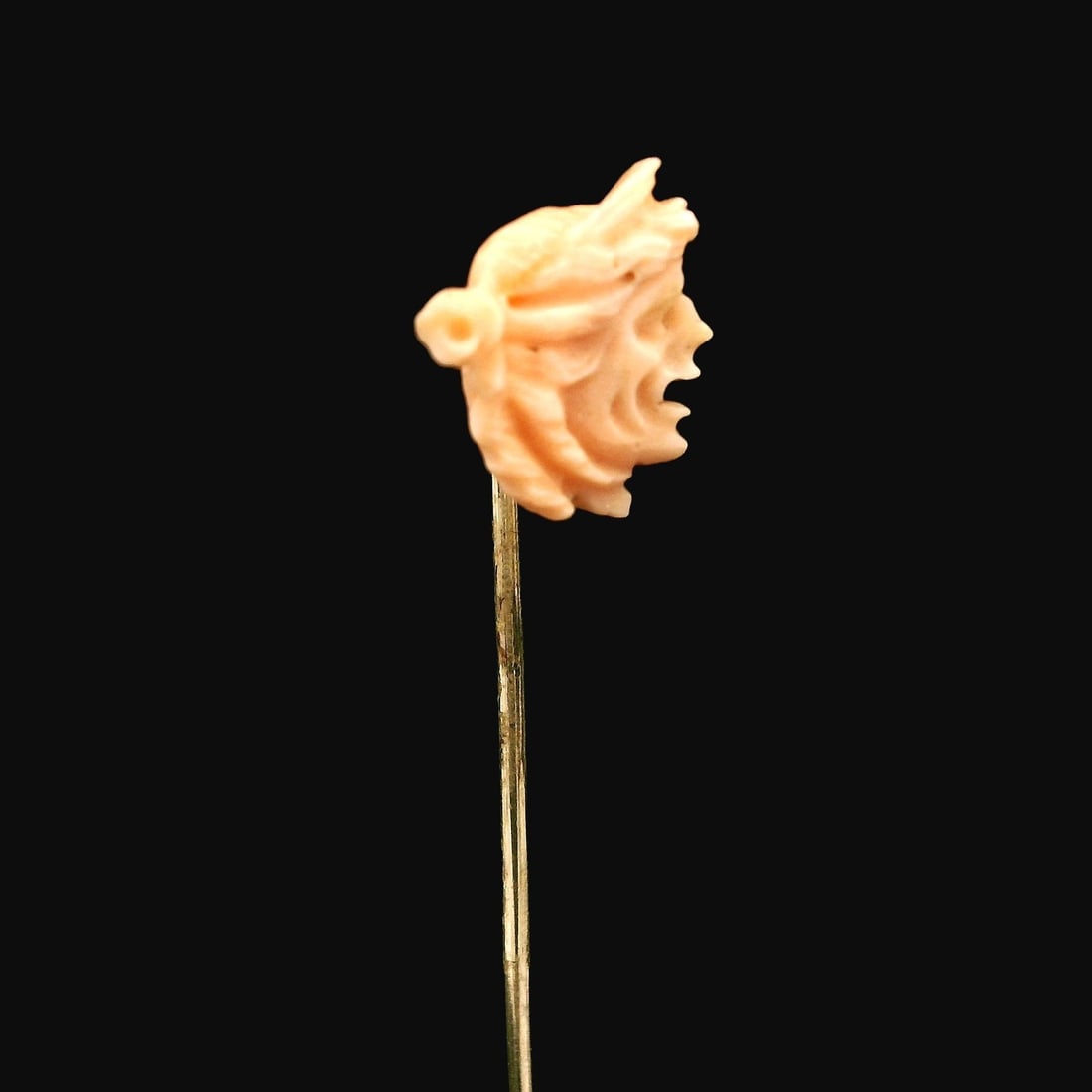 Antique Victorian 14k Yellow Gold Carved Coral Trojan Stick Pin: Antique Victorian 14k Yellow Gold Carved Coral Trojan Stick Pin This exquisite Antique Victorian Stick Pin showcases a beautifully carved coral Trojan in a soft pink hue, set in solid 14k yellow gold.