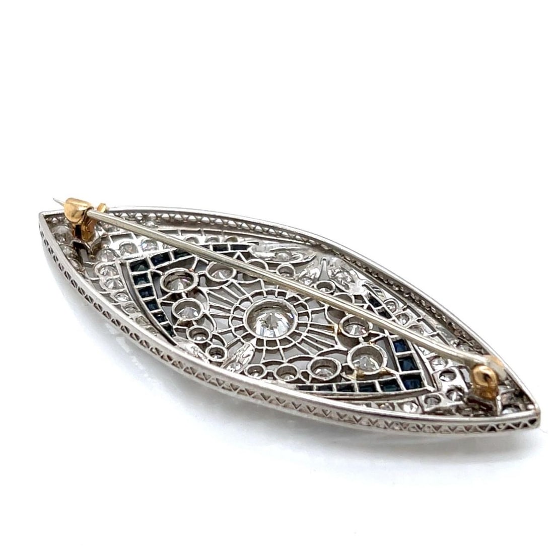 Art Deco Platinum Brooch with 65 Diamonds and 22 Sapphires: Art Deco Platinum Brooch with 65 Diamonds and 22 Sapphires This exquisite Art Deco brooch features a stunning combination of platinum, diamonds, and sapphires. Weighing 10.1 grams, it is adorned with 
