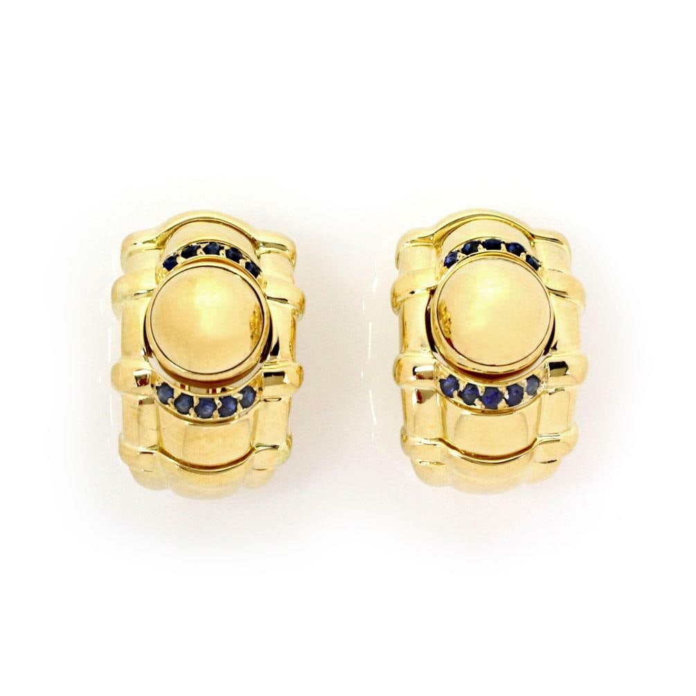 Authentic Piaget 18k Yellow Gold Sapphire Dome Clip Earrings: Authentic Piaget 18k Yellow Gold Sapphire Dome Clip Earrings Elevate your elegance with these authentic Piaget earrings, exquisitely crafted from 18k yellow gold featuring a polished finish. The uniqu