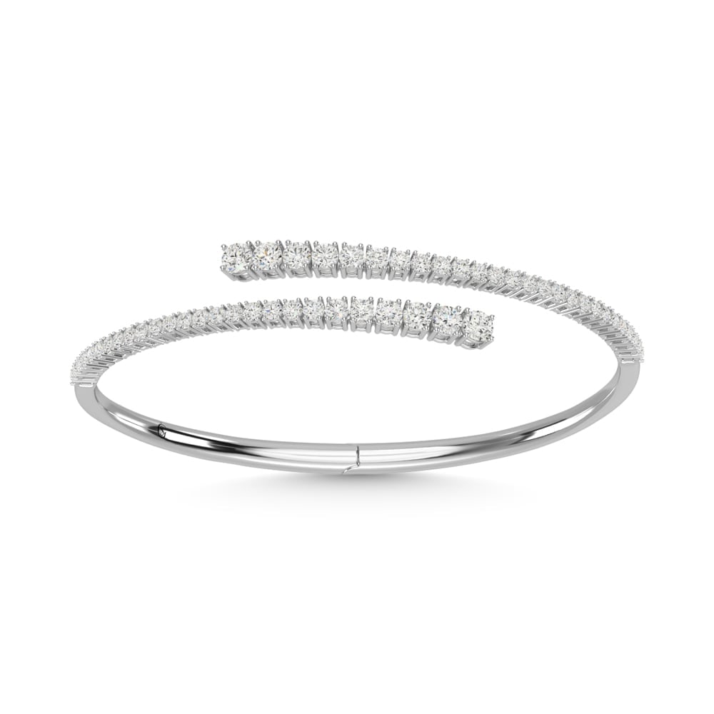 14K White Gold Diamond 2 5/8 Ct.Tw. Fashion Bangle: 14K White Gold Diamond 2 5/8 Ct.Tw. Fashion Bangle 14k White Gold Stone Color: G-h Stone Clarity: Si1 This item may take 2-5 weeks for shipping. The Diamond Depot Guarantee: All items in this auction 