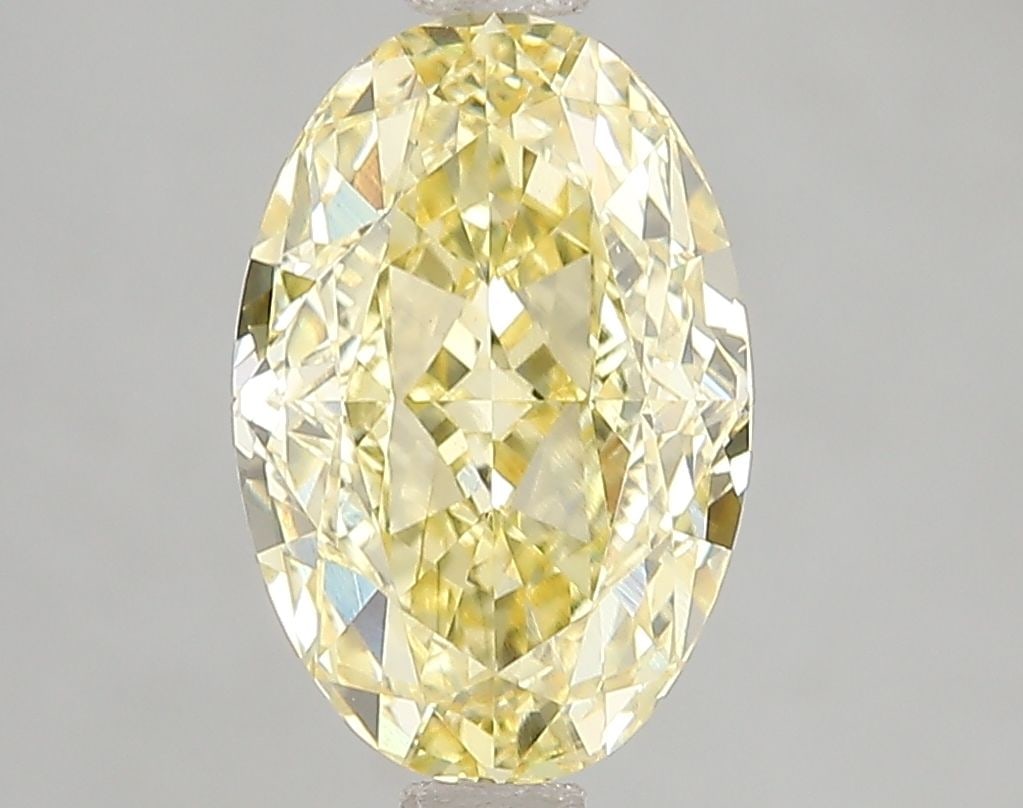 Loose Diamond - OVAL 3.07ct Fancy Vivid Yellow VS1: Loose Diamond - OVAL 3.07ct Fancy Vivid Yellow VS1 Source: This is a real non-mined Diamond that has been grown in a lab Shape: OVAL Carats: 3.07 Color: Fancy Vivid Yellow Certification: IGI Video: