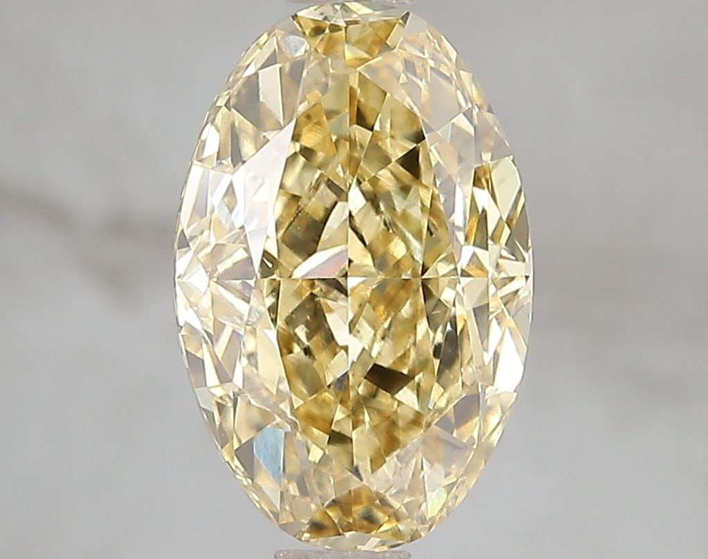 Loose Diamond - OVAL 3.11ct Fancy Vivid Yellow VS2: Loose Diamond - OVAL 3.11ct Fancy Vivid Yellow VS2 Source: This is a real non-mined Diamond that has been grown in a lab Shape: OVAL Carats: 3.11 Color: Fancy Vivid Yellow Certification: IGI Video: