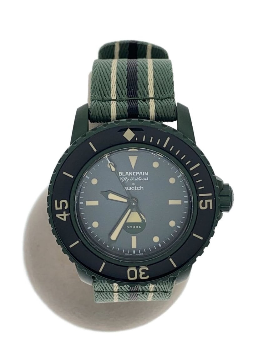 BlancpainxSwatch Green Fifty Fathoms Wristwatch: BlancpainxSwatch Green Fifty Fathoms Wristwatch This BLANCPAINxSWATCH Fifty Fathoms men's wristwatch features a green color scheme and is Swiss-made. The watch is in used condition with a B grade, sho