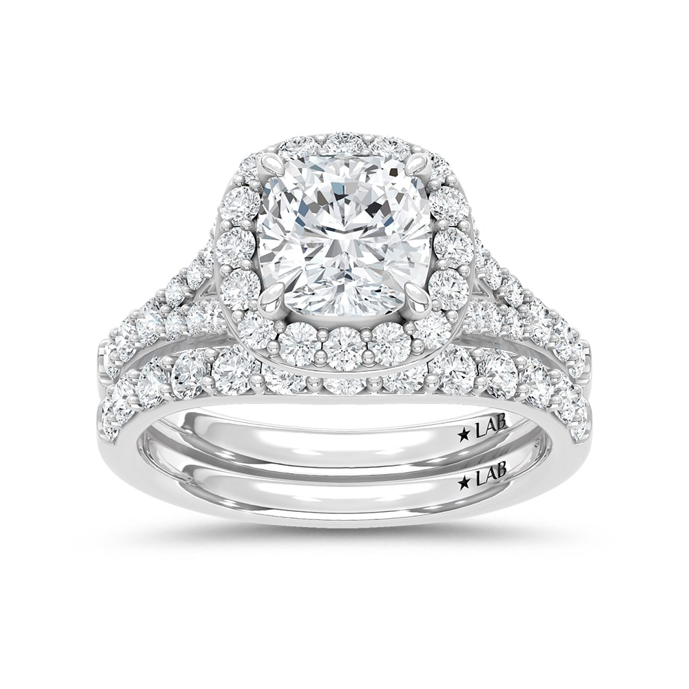 14K White Gold 3 Ct.Tw. Lab Grown Diamond Cushion Shape Bridal Ring (IGI Certified Center 2ct): 14K White Gold 3 Ct.Tw. Lab Grown Diamond Cushion Shape Bridal Ring (IGI Certified Center 2ct) 14k White Gold Stone Color: D-f Stone Clarity: Vs Each ring is presented in standard size 6.5. Compliment