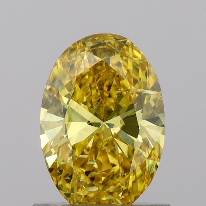 Loose Diamond - OVAL 0.88ct Fancy Vivid Yellow SI2: Loose Diamond - OVAL 0.88ct Fancy Vivid Yellow SI2 Source: This is a real non-mined Diamond that has been grown in a lab Shape: OVAL Carats: 0.88 Color: Fancy Vivid Yellow Certification: IGI Video: