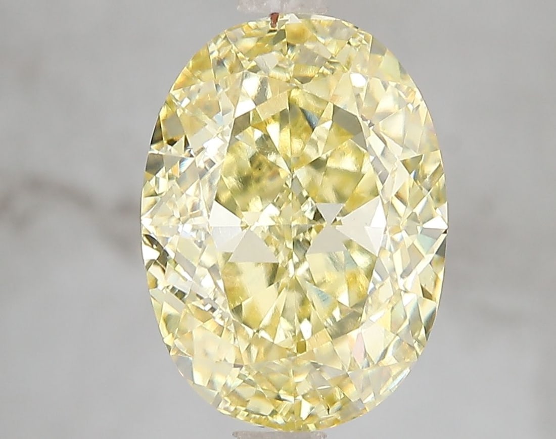 Loose Diamond - OVAL 5.01ct Fancy Vivid Yellow VS2: Loose Diamond - OVAL 5.01ct Fancy Vivid Yellow VS2 Source: This is a real non-mined Diamond that has been grown in a lab Shape: OVAL Carats: 5.01 Color: Fancy Vivid Yellow Certification: IGI Video: