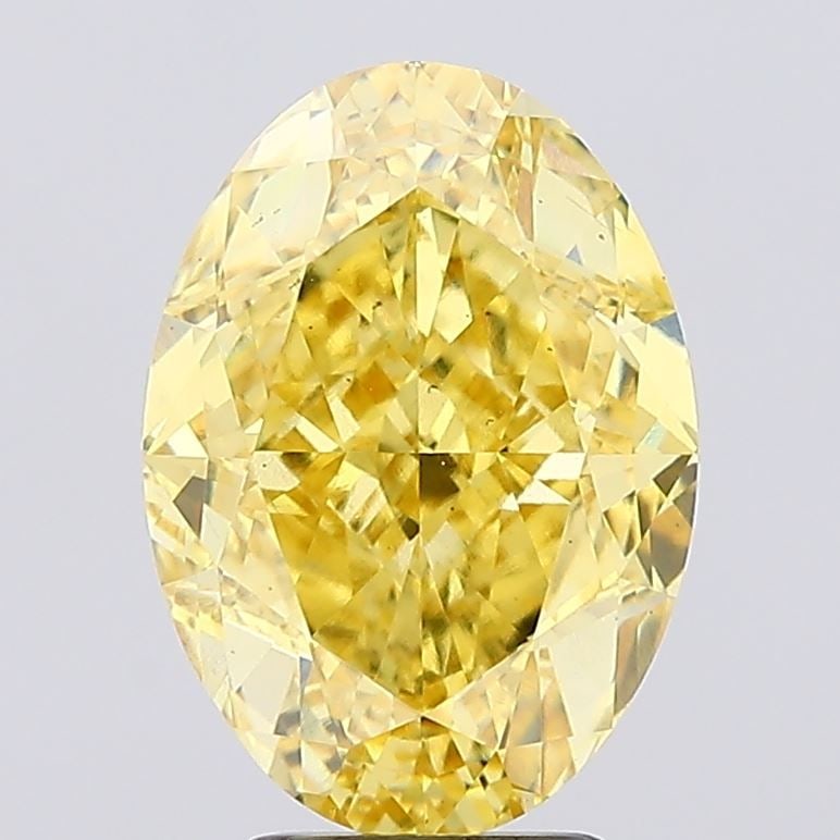 Loose Diamond - OVAL 5.24ct Fancy Vivid Yellow VS2: Loose Diamond - OVAL 5.24ct Fancy Vivid Yellow VS2 Source: This is a real non-mined Diamond that has been grown in a lab Shape: OVAL Carats: 5.24 Color: Fancy Vivid Yellow Certification: IGI Video: