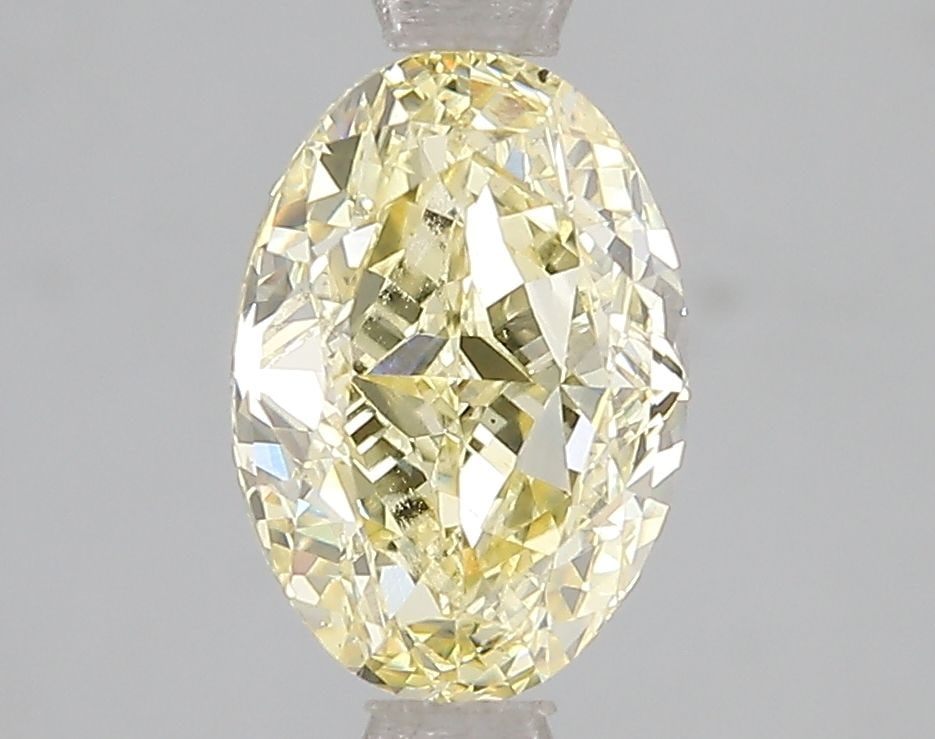 Loose Diamond - OVAL 2.1ct Fancy Intense Yellow VS2: Loose Diamond - OVAL 2.1ct Fancy Intense Yellow VS2 Source: This is a real non-mined Diamond that has been grown in a lab Shape: OVAL Carats: 2.1 Color: Fancy Intense Yellow Certification: IGI Video: