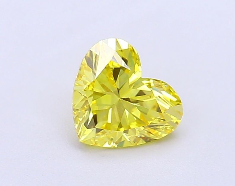 Loose Diamond - HEART 1.03ct Fancy Vivid Yellow VS1: Loose Diamond - HEART 1.03ct Fancy Vivid Yellow VS1 Source: This is a real non-mined Diamond that has been grown in a lab Shape: HEART Carats: 1.03 Color: Fancy Vivid Yellow Certification: IGI Video: