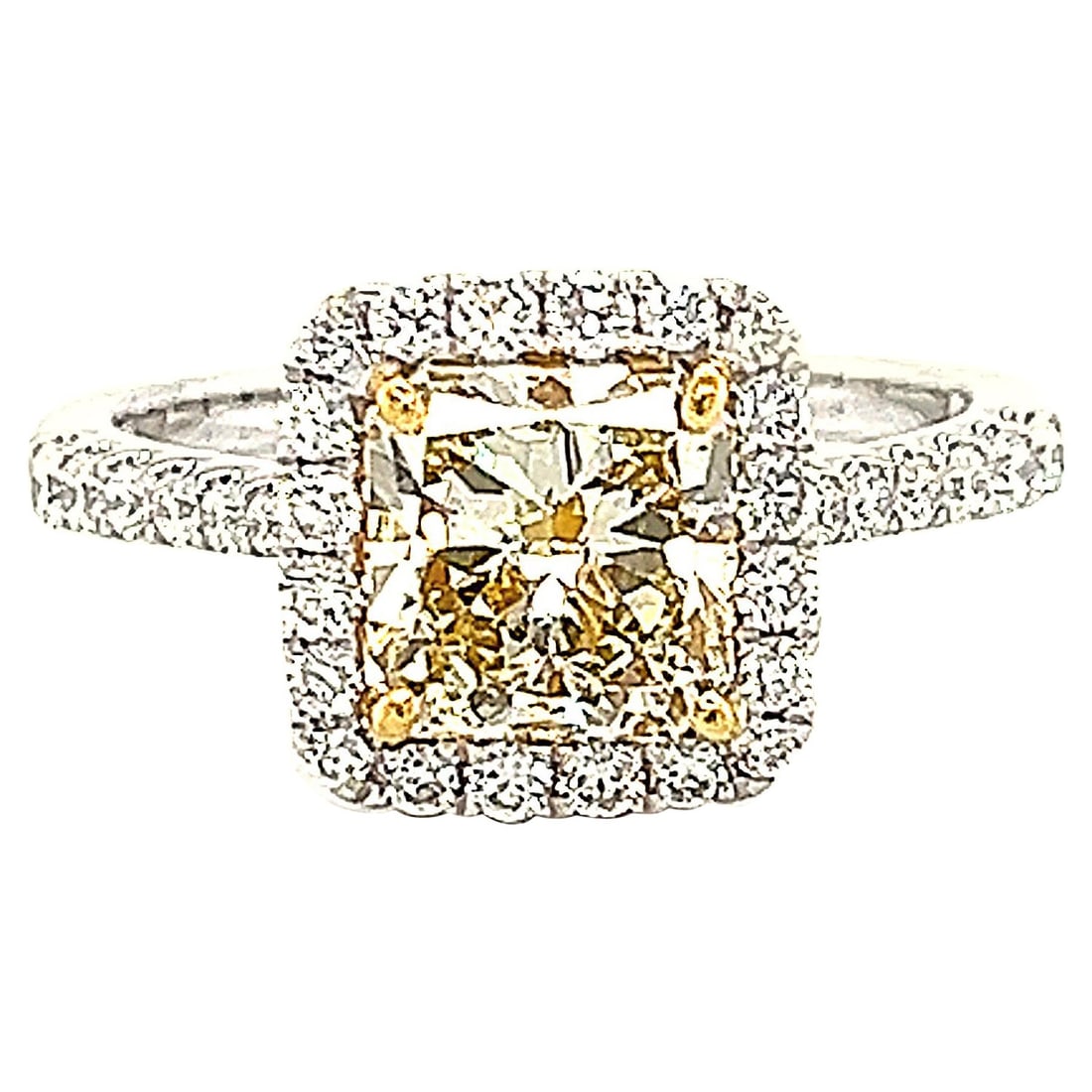 2.34ct Fancy Yellow VS1 Halo Diamond Ring 18k Gold: 2.34ct Fancy Yellow VS1 Halo Diamond Ring 18k Gold This exquisite 2.34ctt Fancy Yellow VS1 Radiant Diamond Halo Ring is a stunning piece of contemporary jewelry. Crafted from 18k two-tone gold, it fea