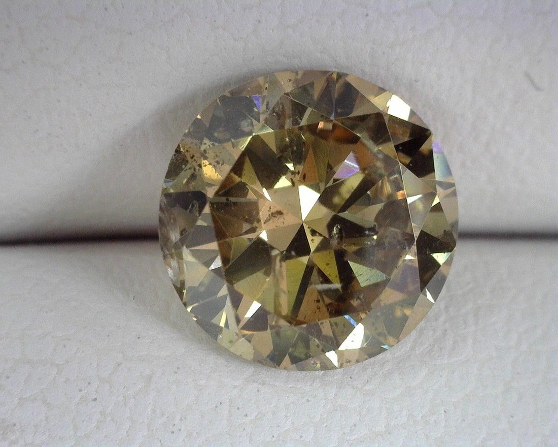 Loose Diamond - ROUND 1.56ct Brown I1: Loose Diamond - ROUND 1.56ct Brown I1 Source: Natural Shape: ROUND Carats: 1.56 Color: Brown Certification: OTHER The Diamond Depot Guarantee: All items in this auction are guaranteed to be 100% authe