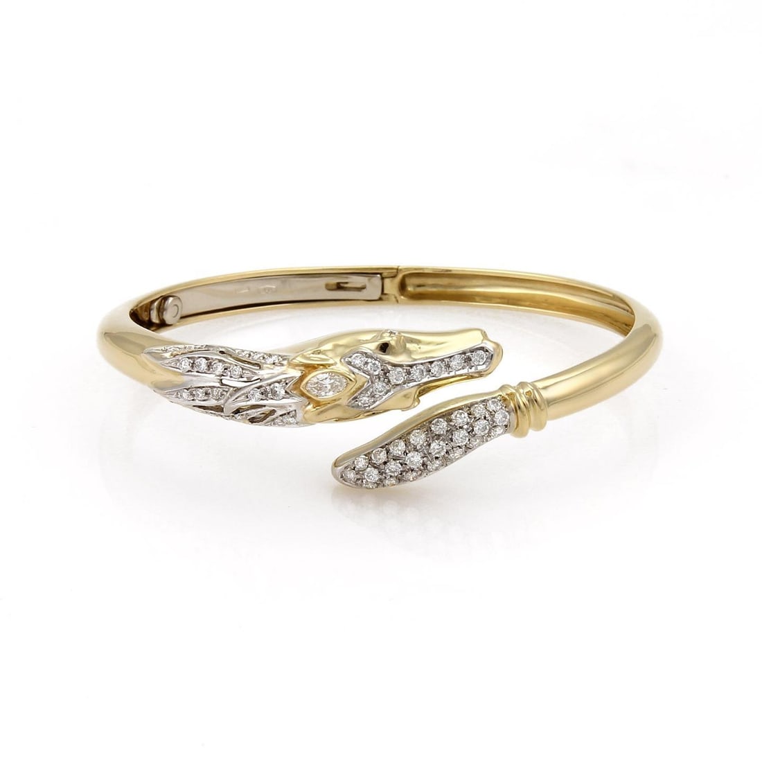 18k Gold Horse Bypass Bracelet with 1.10ct Diamonds: 18k Gold Horse Bypass Bracelet with 1.10ct Diamonds This exquisite equestrian-inspired bracelet is crafted from 18k yellow and white gold, showcasing a stunning horse's head on one end and its tail on
