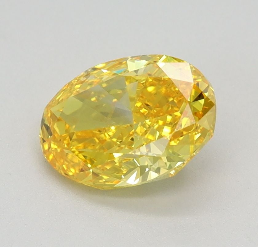 Loose Diamond - OVAL 0.87ct Fancy Vivid Yellow VVS2: Loose Diamond - OVAL 0.87ct Fancy Vivid Yellow VVS2 Source: This is a real non-mined Diamond that has been grown in a lab Shape: OVAL Carats: 0.87 Color: Fancy Vivid Yellow Certification: IGI Video: