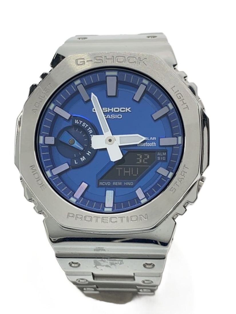 Casio G Shock Blue Men's Wristwatch GM-B2100AD-2AJF: Casio G Shock Blue Men's Wristwatch GM-B2100AD-2AJF This is a Casio G-SHOCK GM-B2100AD-2AJF men's wristwatch, featuring a blue case and band. The watch is pre-owned and shows slight signs of use. It i