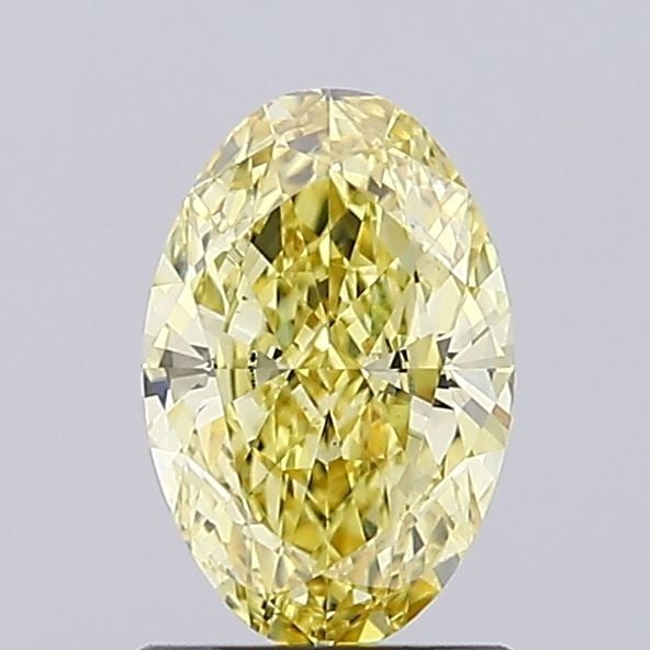 Loose Diamond - OVAL 1.12ct Fancy Vivid Yellow VS1: Loose Diamond - OVAL 1.12ct Fancy Vivid Yellow VS1 Source: This is a real non-mined Diamond that has been grown in a lab Shape: OVAL Carats: 1.12 Color: Fancy Vivid Yellow Certification: IGI Video: