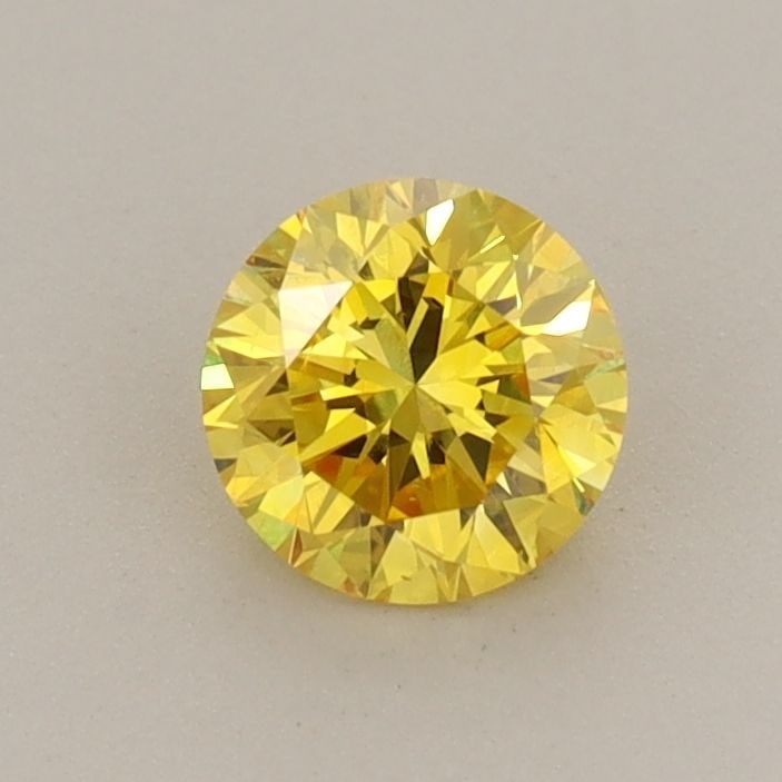 Loose Diamond - ROUND 0.57ct Fancy Vivid Yellow VS1: Loose Diamond - ROUND 0.57ct Fancy Vivid Yellow VS1 Source: This is a real non-mined Diamond that has been grown in a lab Shape: ROUND Carats: 0.57 Color: Fancy Vivid Yellow Certification: IGI Video: