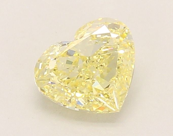 Loose Diamond - HEART 1.05ct Fancy Yellow VVS2: Loose Diamond - HEART 1.05ct Fancy Yellow VVS2 Source: This is a real non-mined Diamond that has been grown in a lab Shape: HEART Carats: 1.05 Color: Fancy Yellow Certification: IGI Video: