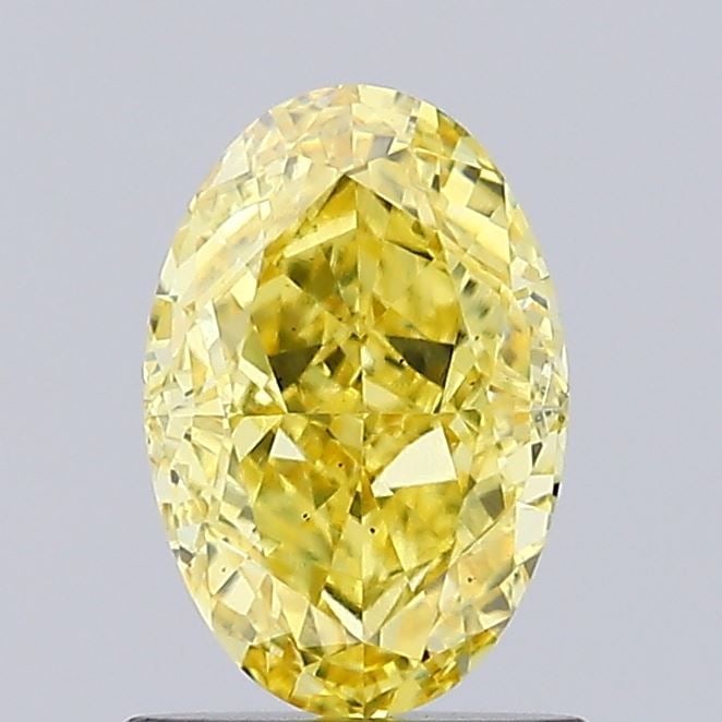 Loose Diamond - OVAL 1.01ct Fancy Vivid Yellow VS2: Loose Diamond - OVAL 1.01ct Fancy Vivid Yellow VS2 Source: This is a real non-mined Diamond that has been grown in a lab Shape: OVAL Carats: 1.01 Color: Fancy Vivid Yellow Certification: IGI Video: