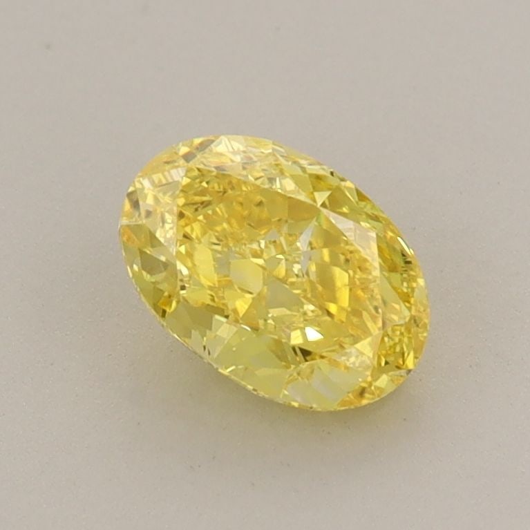 Loose Diamond - OVAL 0.8ct Fancy Vivid Yellow VS1: Loose Diamond - OVAL 0.8ct Fancy Vivid Yellow VS1 Source: This is a real non-mined Diamond that has been grown in a lab Shape: OVAL Carats: 0.8 Color: Fancy Vivid Yellow Certification: IGI Video: